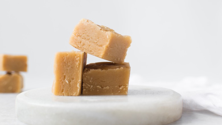 Peanut butter fudge displayed against a white background