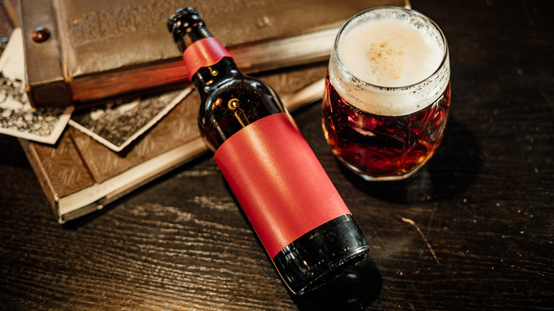 Beer bottle and glass on table