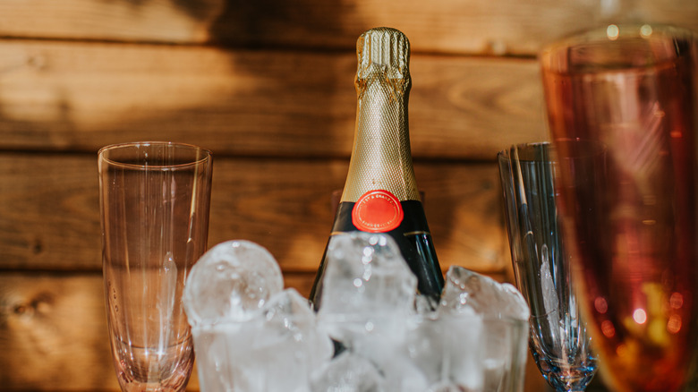 A bottle of sparkling wine on ice