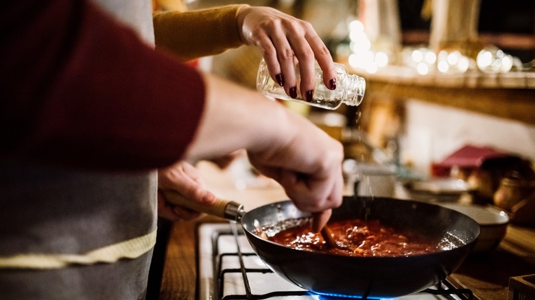Couple making pasta sauce
