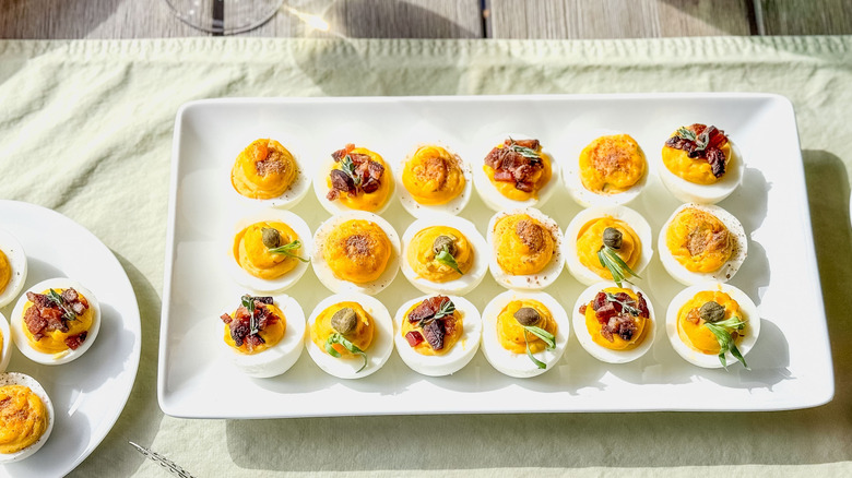 Trio of Easter (or all-year) deviled eggs on serving platter and plate