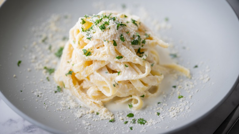 Fettuccine Alfredo in white bowl