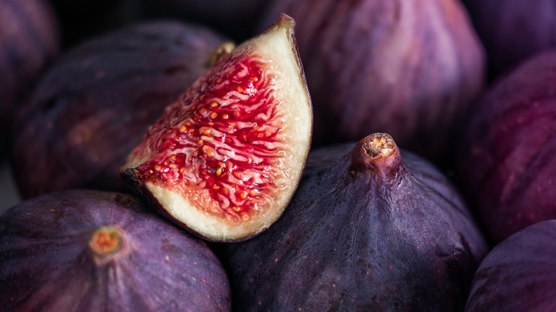 Sliced fig sitting on figs