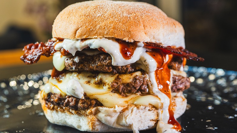 mayo and sauces dripping off a burger