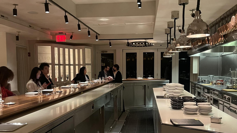 View of diners and the open kitchen at Chef's Table at Brooklyn Fare