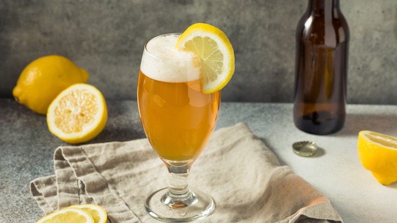 Glass of beer with lemon slice