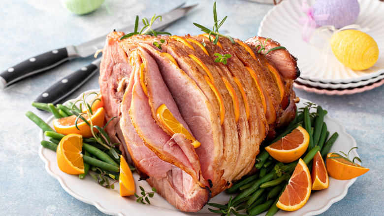 Sliced ham stuffed with orange slices.