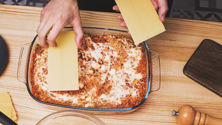 Person making lasagna
