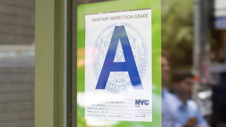 An restaurant health score of A posted outside of restaurant