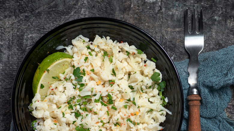 Seasoned cauliflower rice in a ceramic bowl