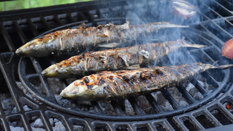 whole Shad smoking on grill