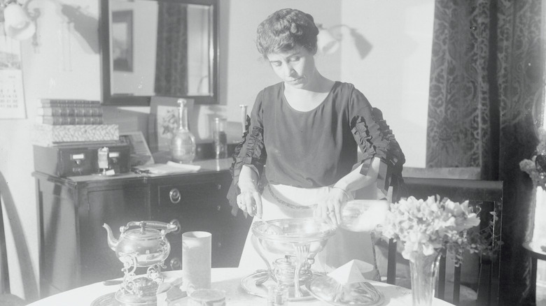 Grace Coolidge serving at a table