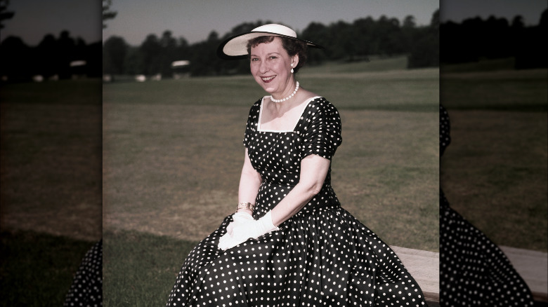 Mamie Eisenhower wear a hat and black and white polka dot dress