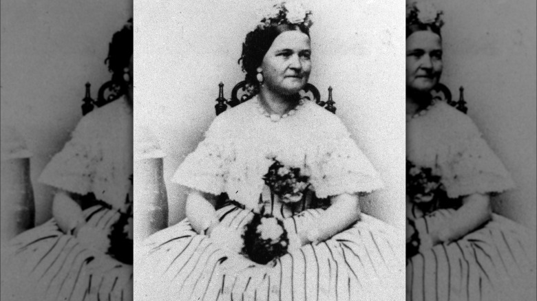 Mary Todd Lincoln posing with a bouquet