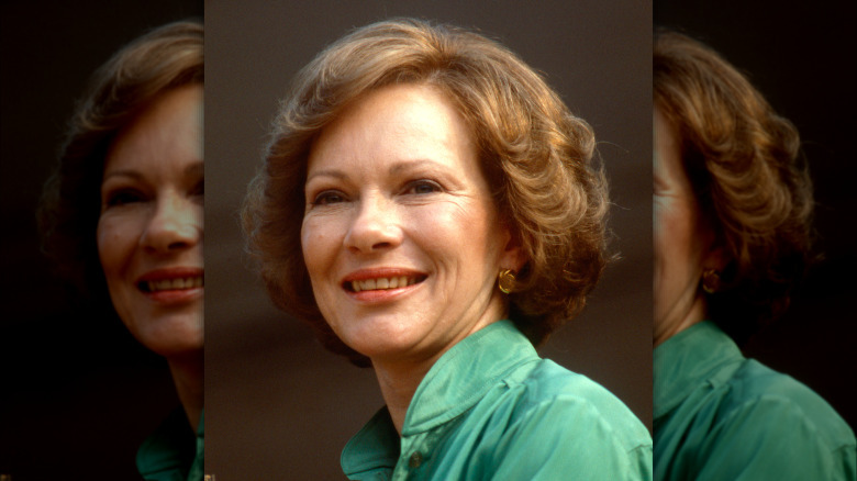 Rosalynn Carter smiling, wearing a green shirt