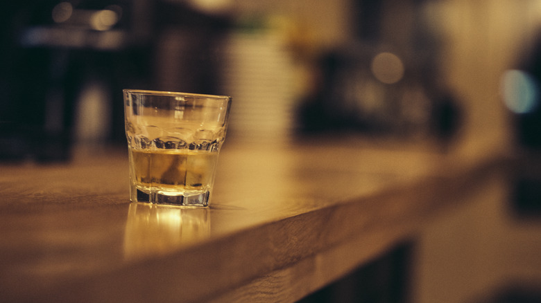 Shot of liquor sitting on a bar counter