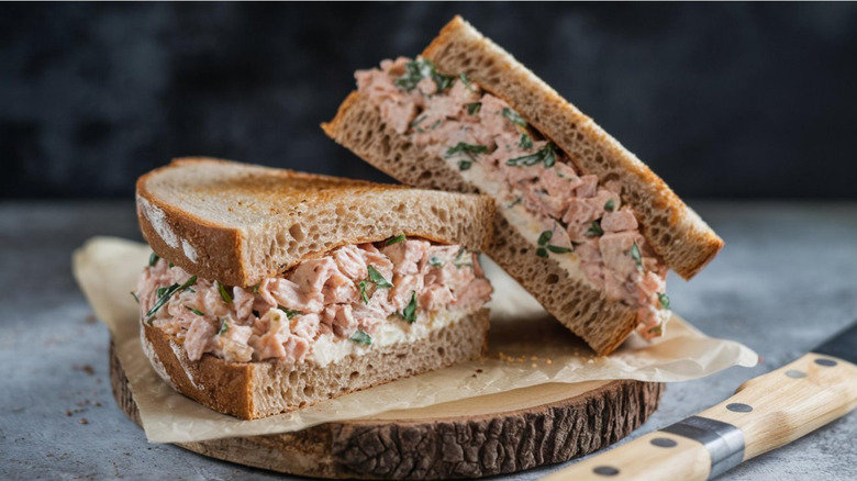 Tuna salad sandwich on wooden board