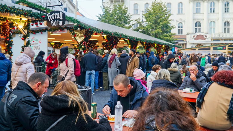 Diners gathered at an outdoor food market in Europe