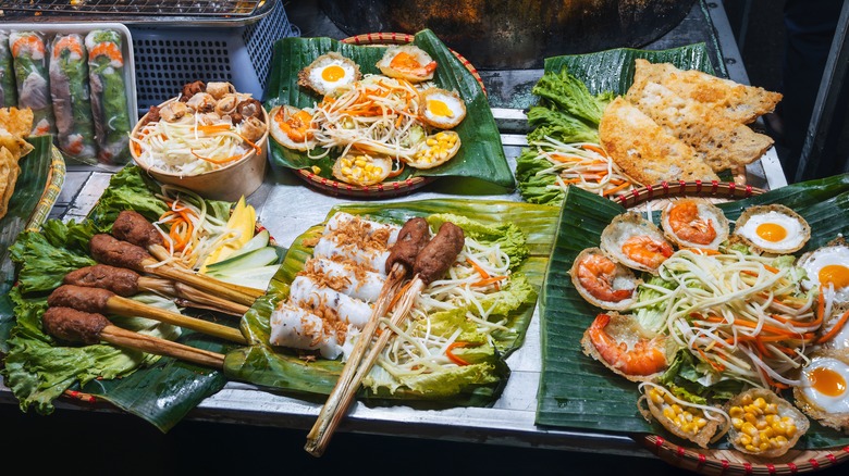 A tantalizing spread of varied Vietnamese dishes served on banana leaves