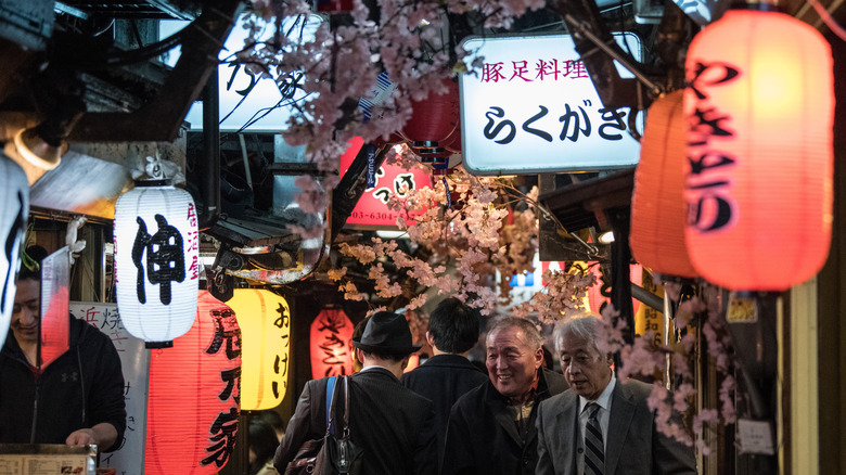 An alleyway full of yakitori vendors in Tokyo, Japan.