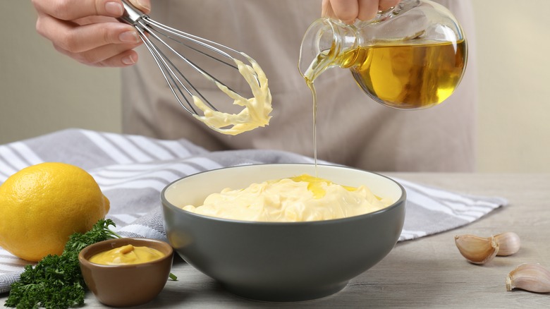Person making homemade mayonnaise