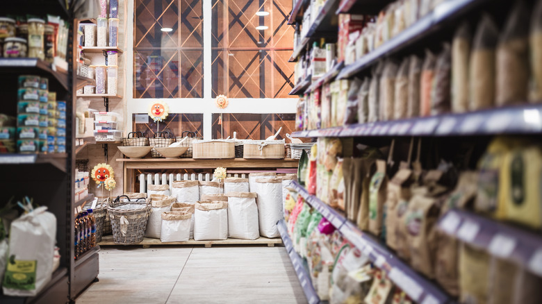 Fully stocked aisle in rustic grocery store