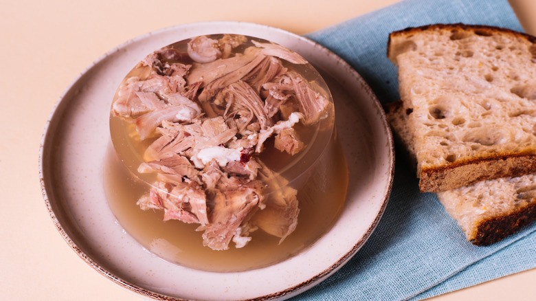 beef jelly aspic next to bread