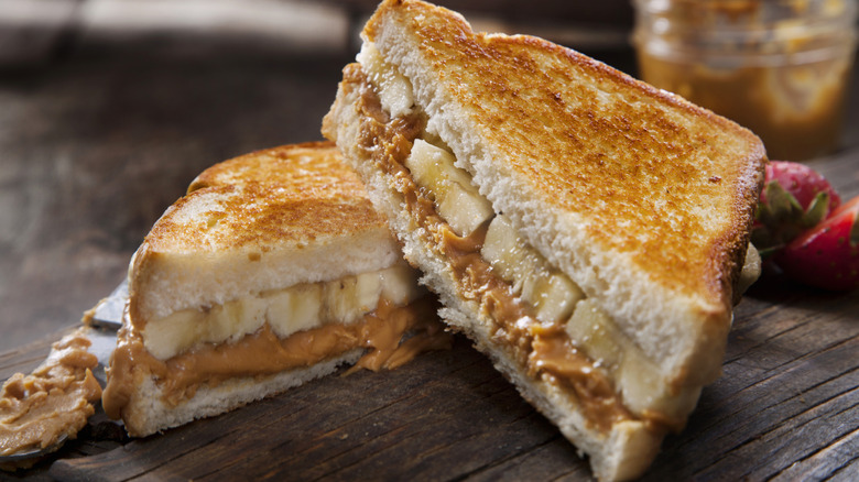 Grilled peanut butter and banana sandwich on a wooden table