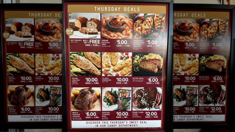 The Fresh Market Thursday meat section deals board.