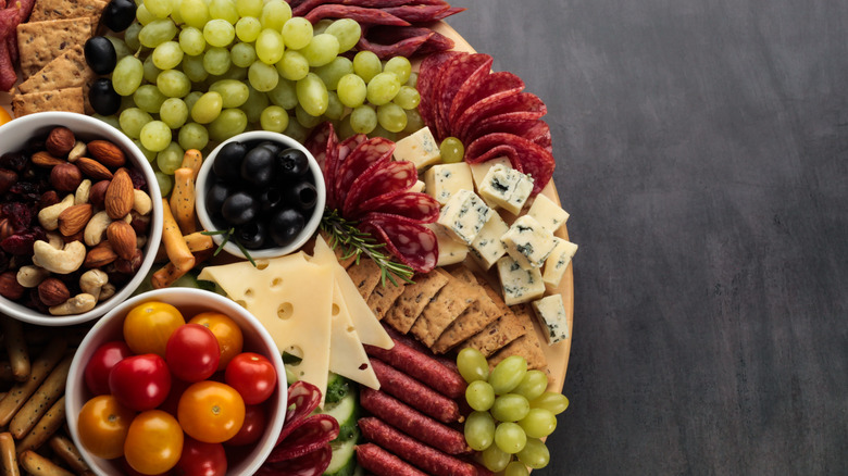 Close up of a meat, cheese, and fruit charcuterie board