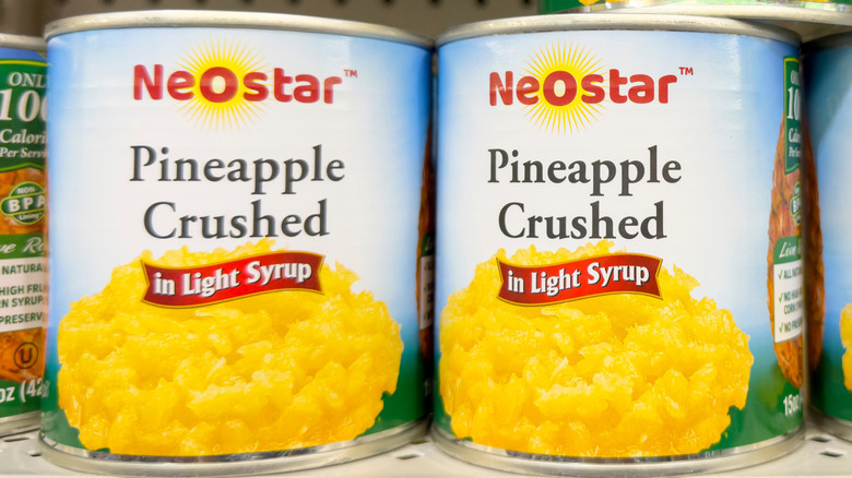 cans of neostar brand crushed pineapple