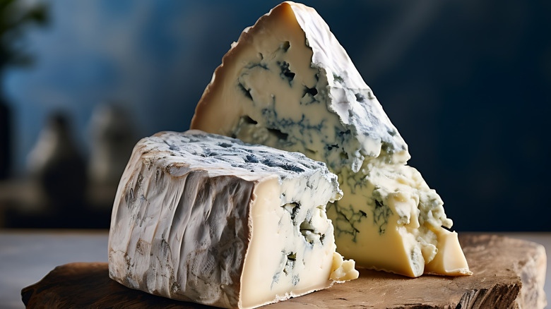 blue cheese wedges on a cutting board