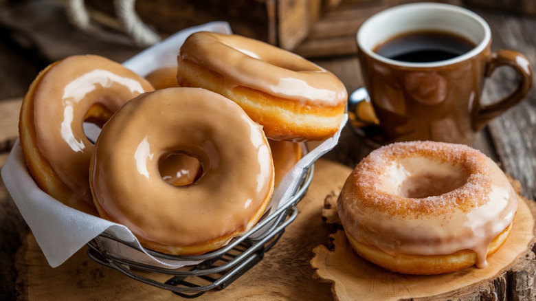 glazed donuts with a cup of coffee