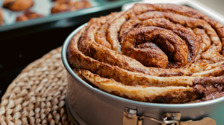 Huge cinnamon roll in a baking dish