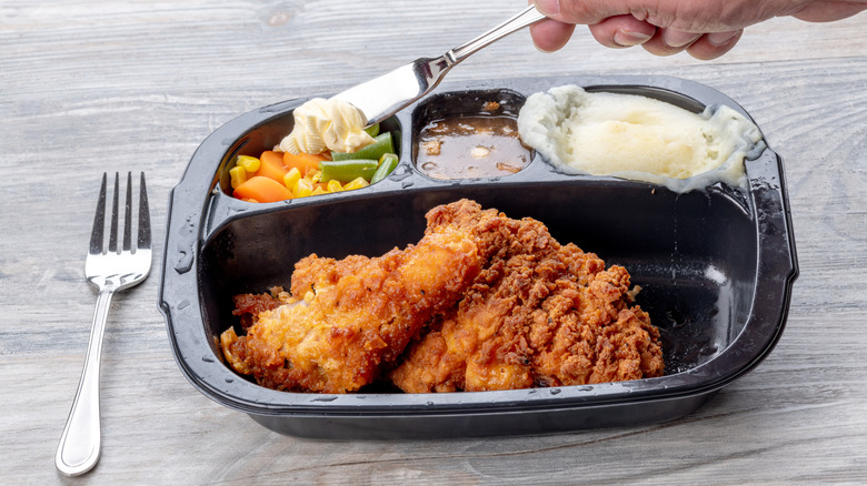 Microwaved TV dinner on table