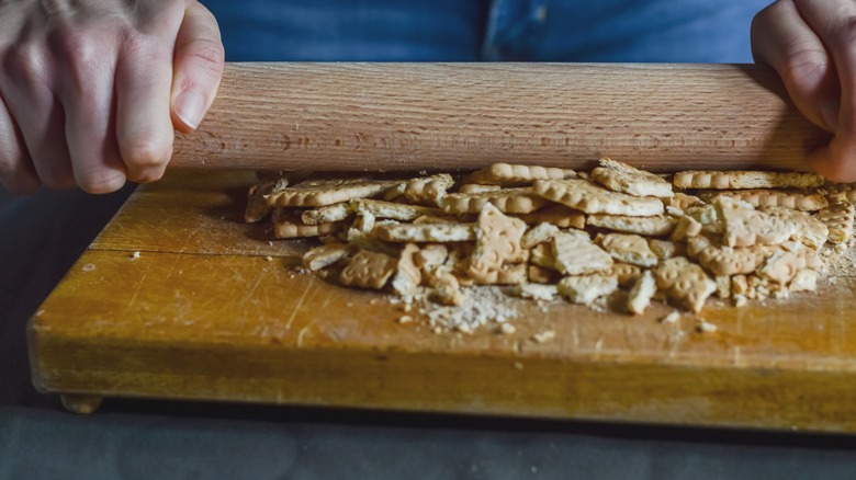 Crushing biscuits with rolling pin
