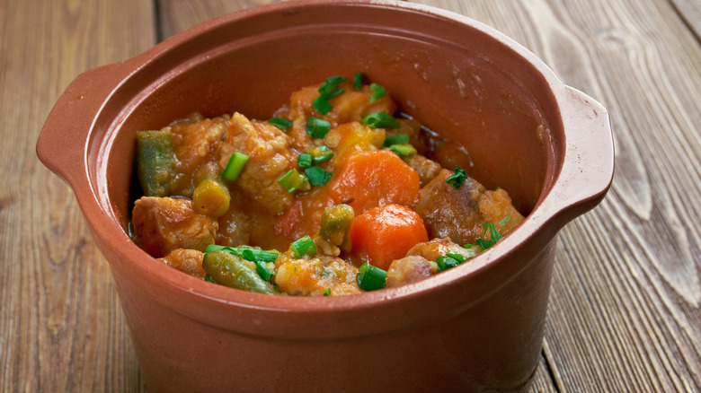 Classic Mulligan stew served in a small brown bowl
