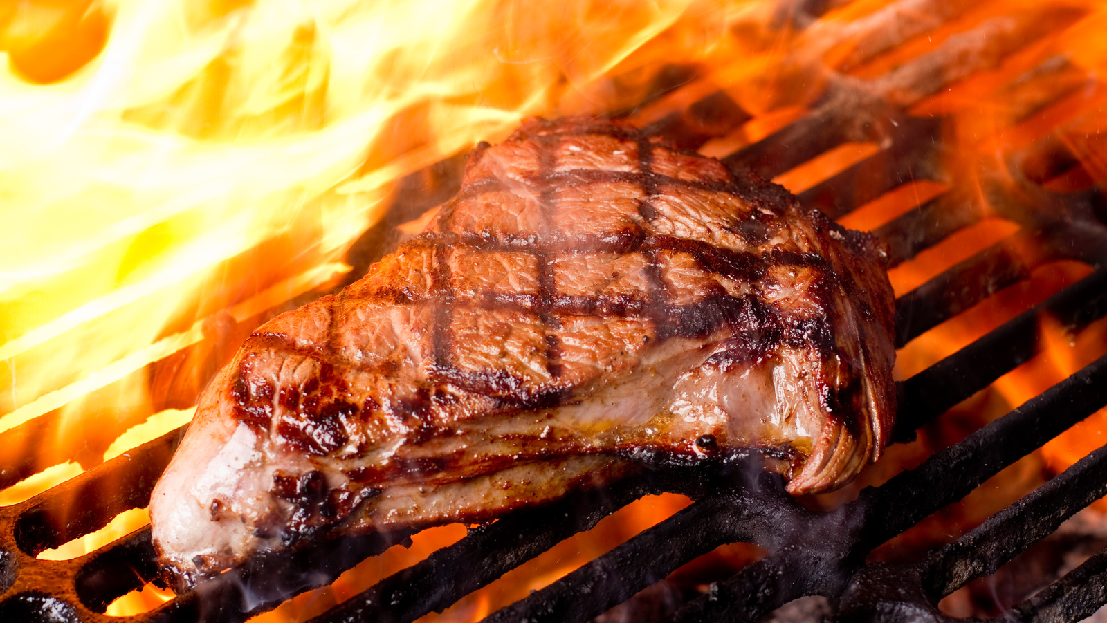 Too much flame is the grilling mistake that makes your meat taste like ash.