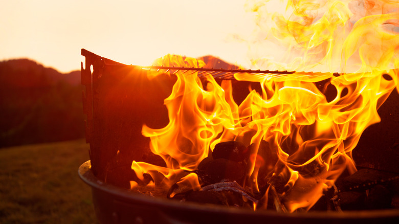 Charcoal grill flaring up.