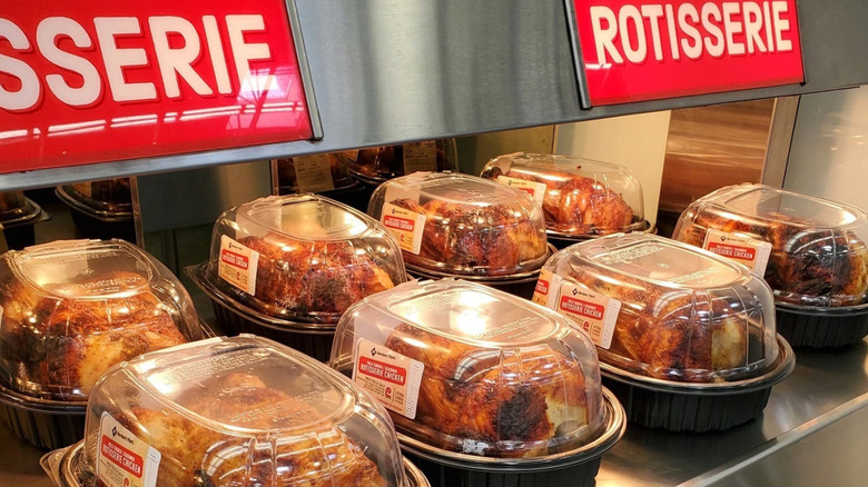 Sam's Club rotisserie chickens on display inside plastic containers