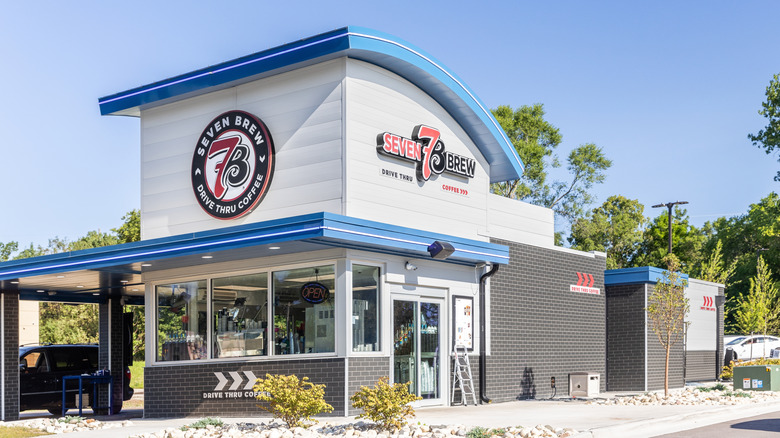 A facade of a 7 Brew shop taken on a sunny day