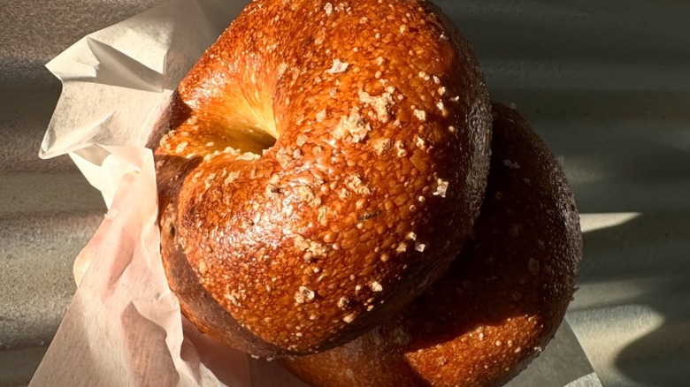 Two bagels with salt in paper