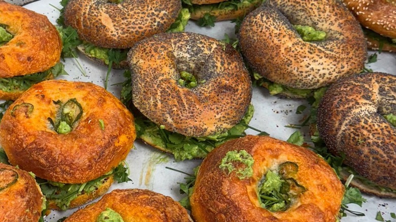 Assortment of bagel sandwiches on tray