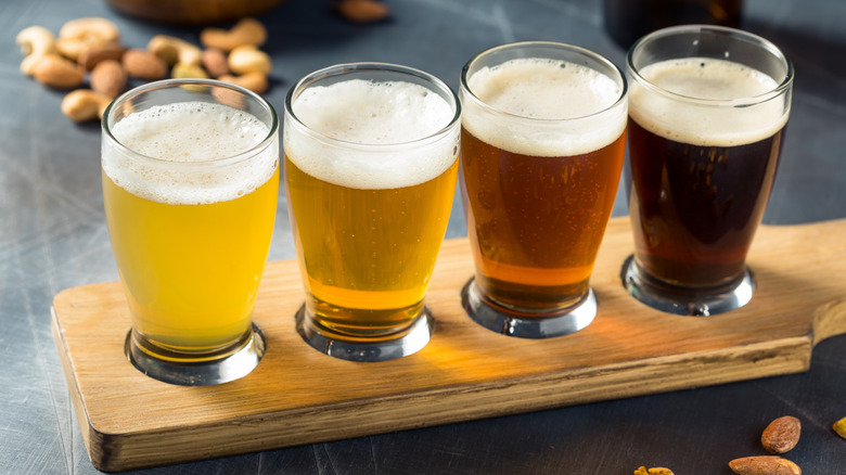 A flight of four beers of various shades