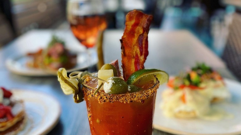 Clear Sky Cafe Bloody Mary on table with food