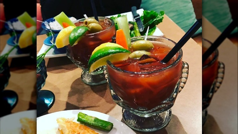Tweet Chicago Bloody Marys in tiki glasses on table