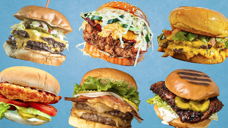 An array of artfully topped burgers in rows against a light blue background.