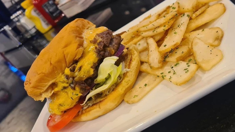 A cheeseburger and fries from JJ's Tavern and Grill.