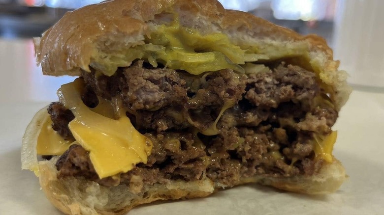 The cross-section of a cheeseburger from Nick's Hamburger Shop.