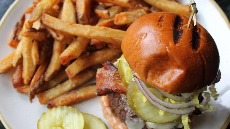 A cheeseburger and fries from The Farmhouse Tap and Grill